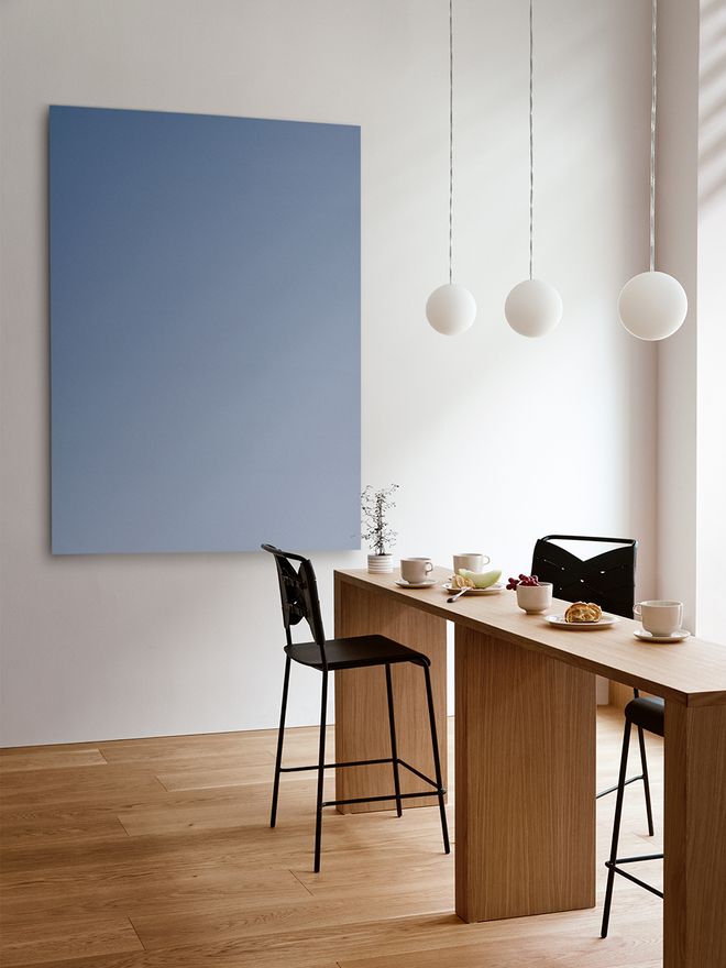 An image featuring Design House Stockholm's Luna lamp as part of the dining room decor.