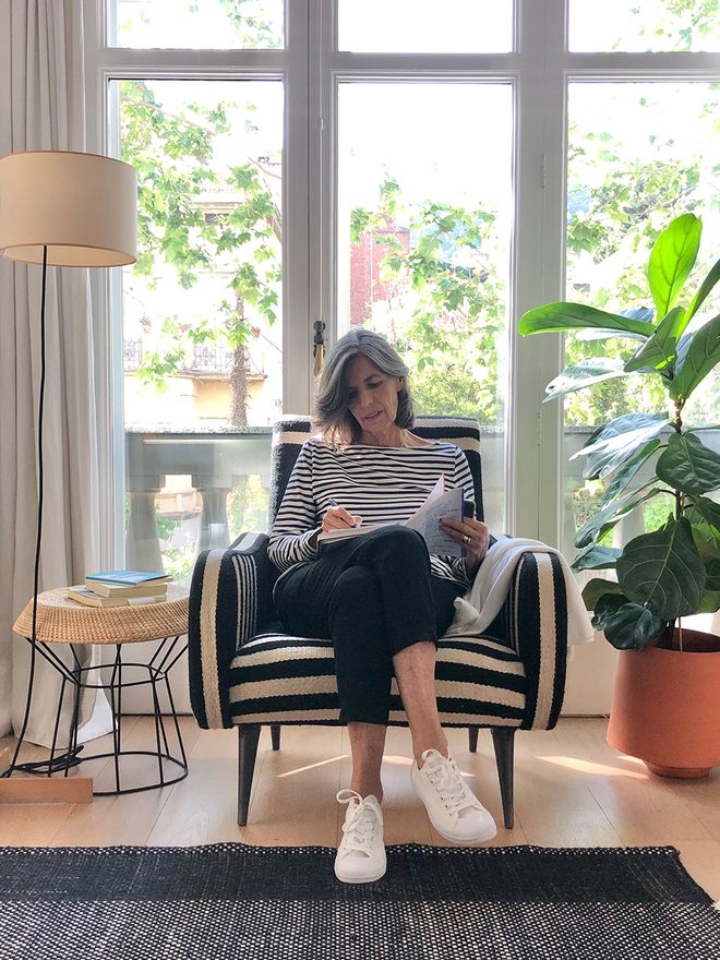 Nani Marquina sitting in a lounge chair