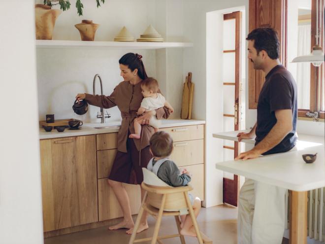 Cecilia and Mateo with their family in the kitchen.