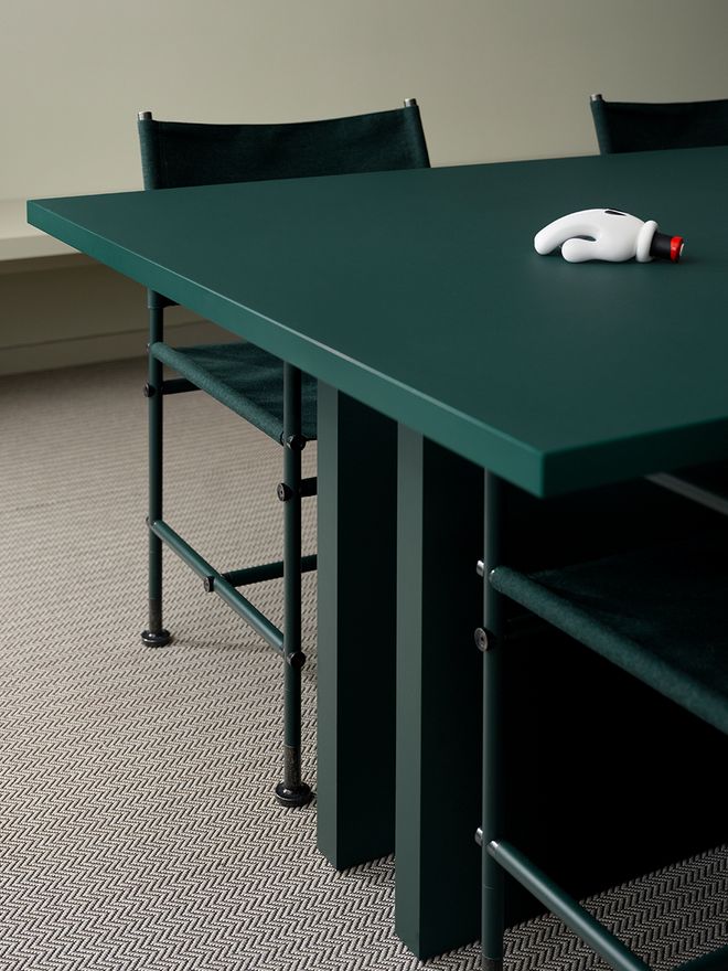 A detail of a dark green table