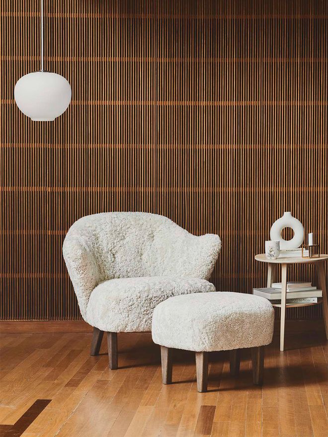 An image featuring by Lassen's Ingeborg lounge chair and ottoman as part of the living room decor.
