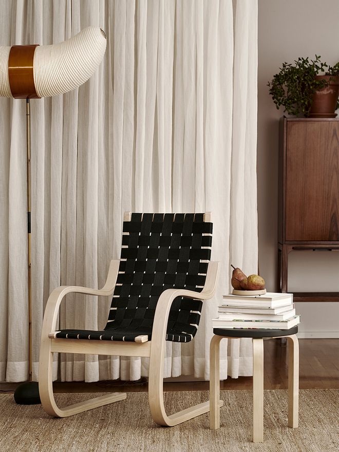 An image featuring Artek's armchair 406 as part of the living room interior.