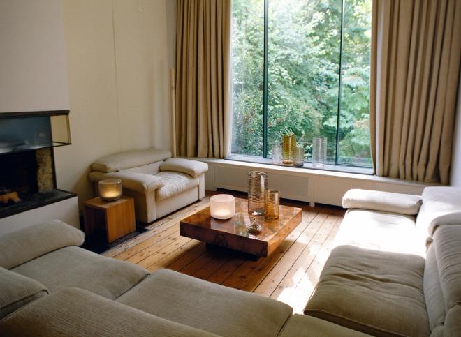 Unda vases and lamps designed by Sabine Marcelis, arranged on the coffee table in the bright living room