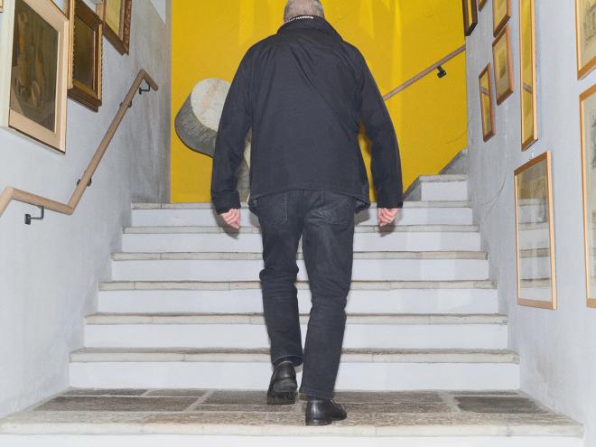 Alessi walking up the stairs