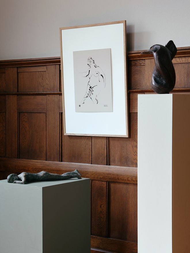An image of Teemu Järvi's In the Meadow art poster hung on the wall.