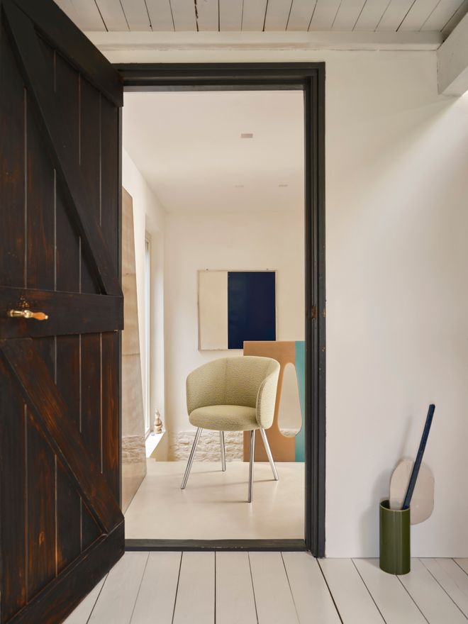 Vitra's Mikado chair in white and Vases Découpage vase in green