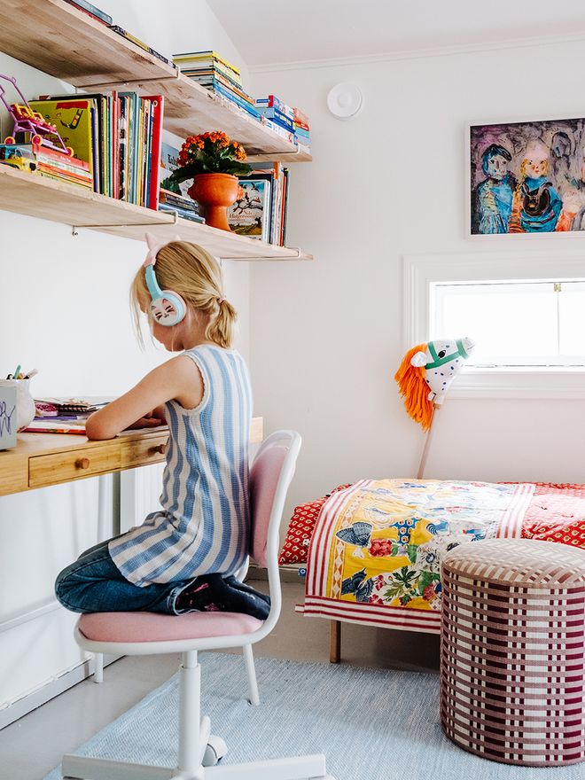 A girl drawing at a desk