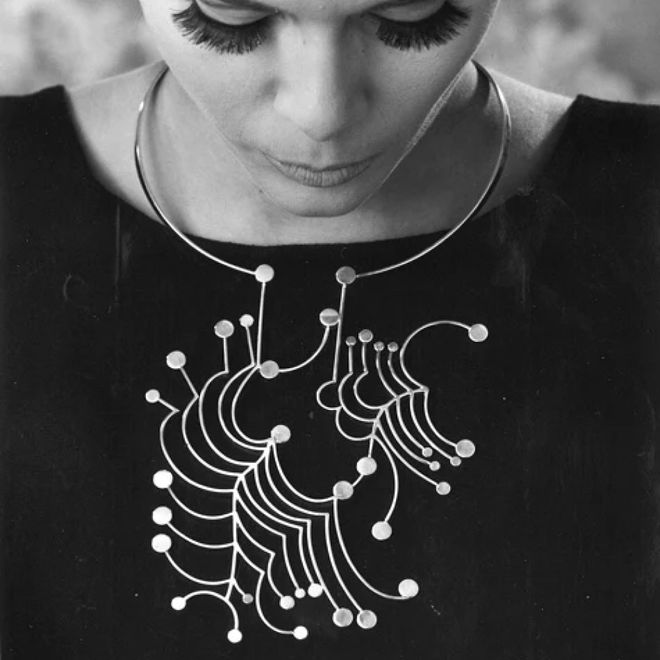Black-and-white close-up of a silver jewellery piece designed by Paula Häiväoja.