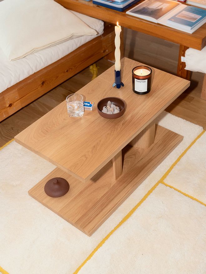 A sofa table with candles