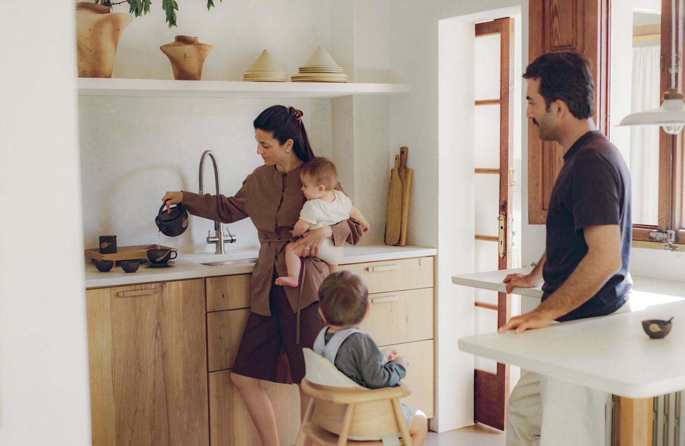Cecilia and Mateo with their family in the kitchen.