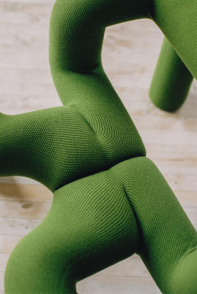 Close-up of an olive green Ekstrem lounge chair