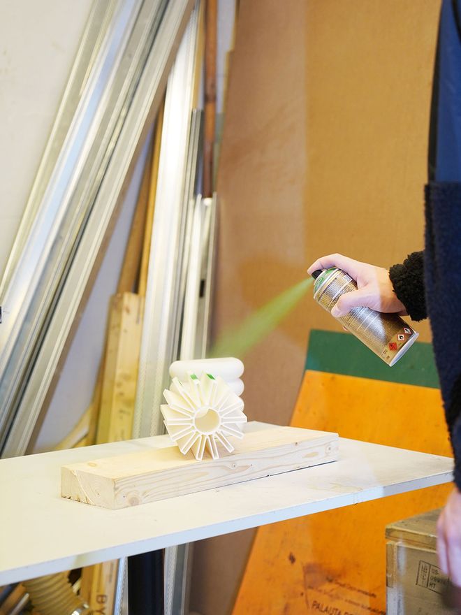 Simon Legald spray painting an object