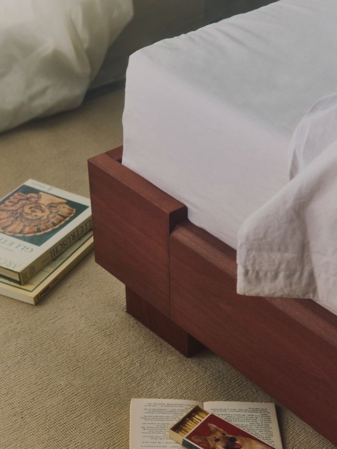 A detail of the dark Cubico bed frame