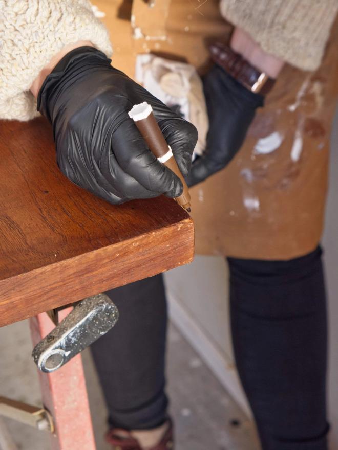 A touch-up pen in teak color