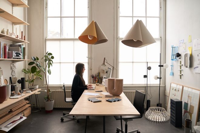 Rachel Grifiin at her desk in her workspace.