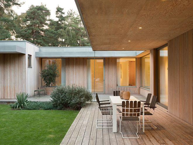 An image of Villa MSV, a private home located in Sweden. The image features the façade and the terrace of Villa MSV.