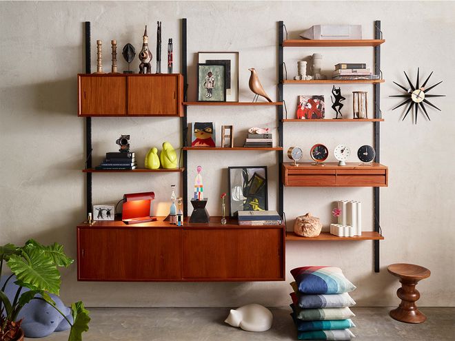 Decor items by Vitra displayed in an open shelving unit.