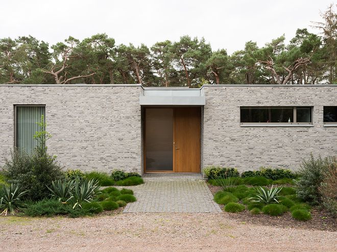 An image of Villa MSV, a private home located in Sweden. The image features the façade and the entrance of Villa MSV.