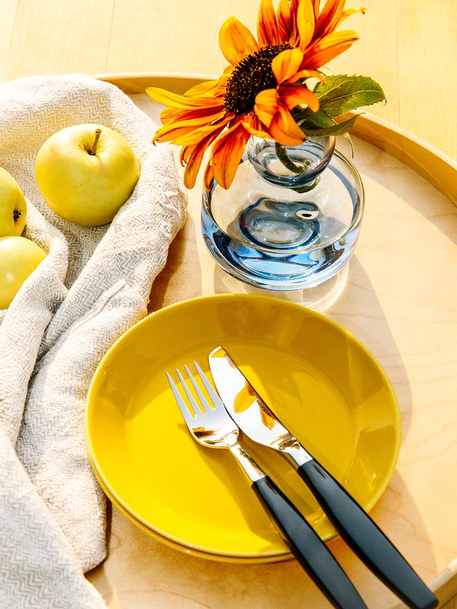 Teema plates in honey by Iittala, blue Flower vase by Marimekko, Lions cutlery by Hackman
