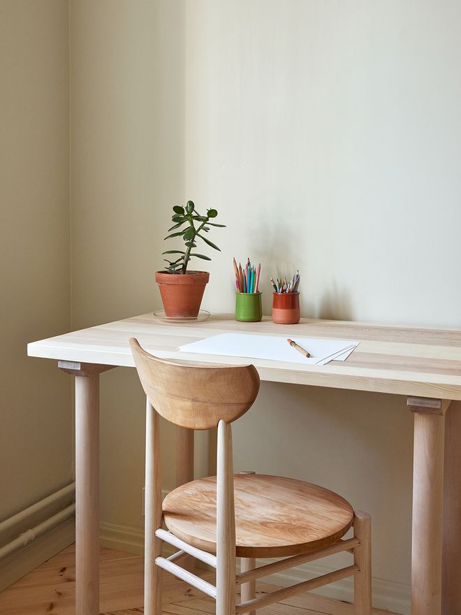 A detail of a wooden chair and desk