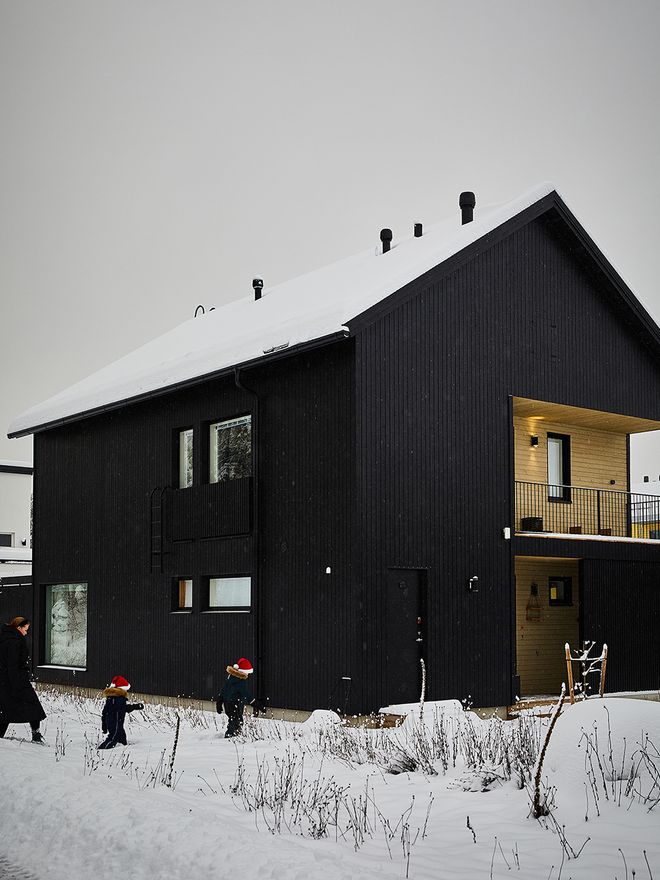 A black house with large windows