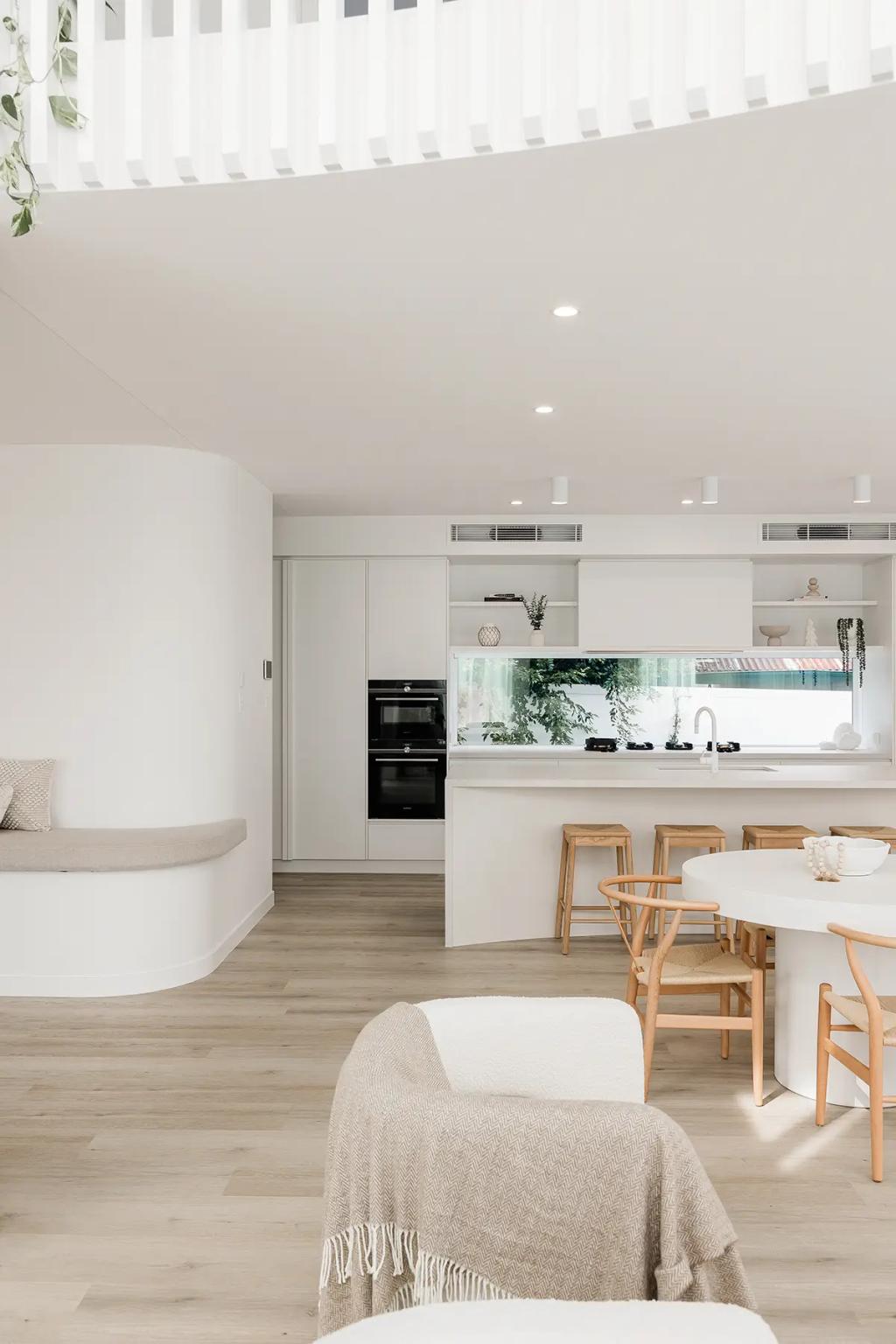 Project Vuse (A modern kitchen with white walls, wooden flooring, and a built-in oven)