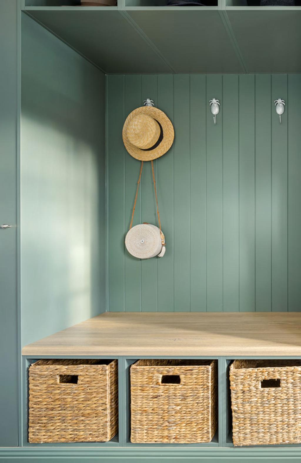Queenie Marlow (Mudroom close up with a vacation hat hanging by the wall)