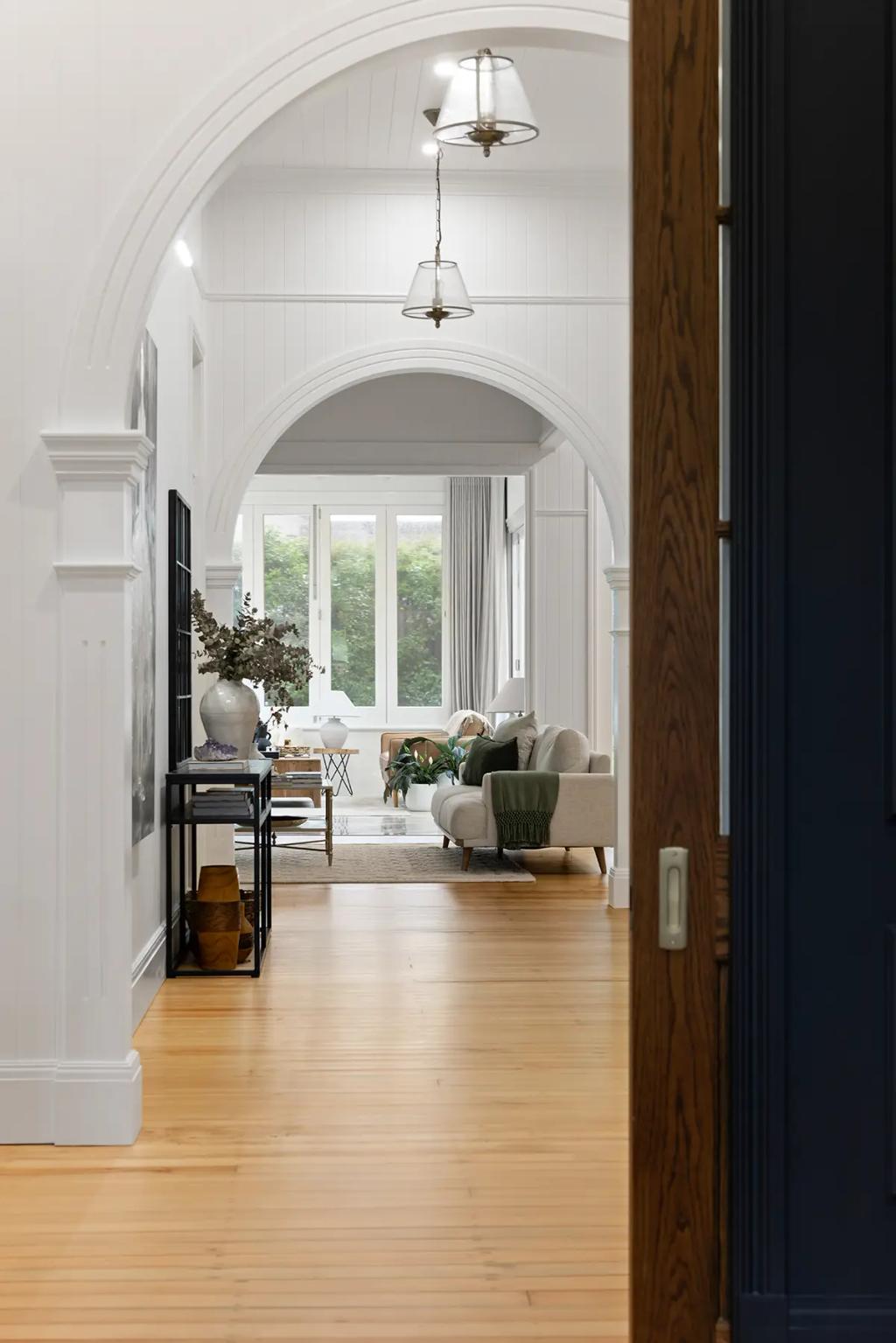 Project Franklin (Layered arches frame a light-filled lounge with garden view)
