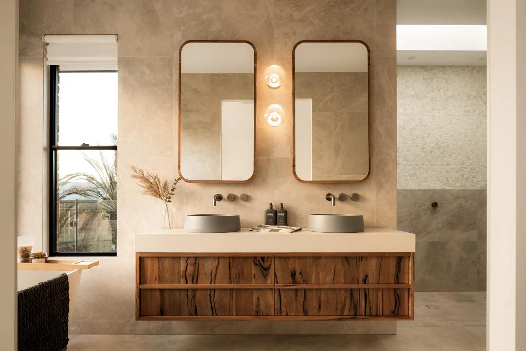 Project Mount Rascal (Modern bathroom with double sinks, wooden vanity, dual mirrors, wall lights, and a window with natural light)