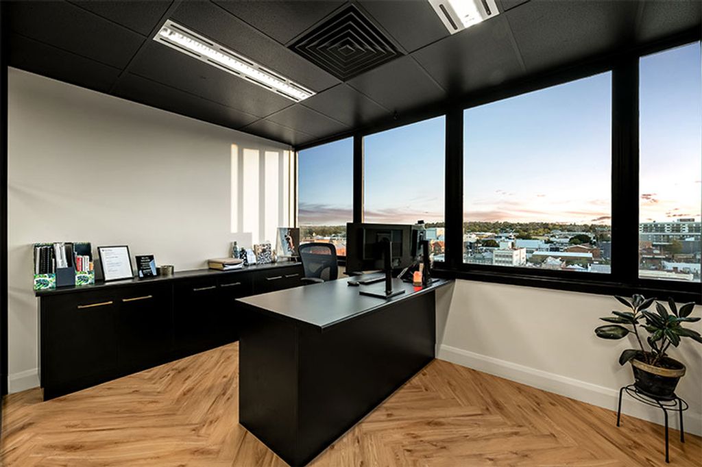 Project Enterprise Legal (black table with computer and office cabinets)