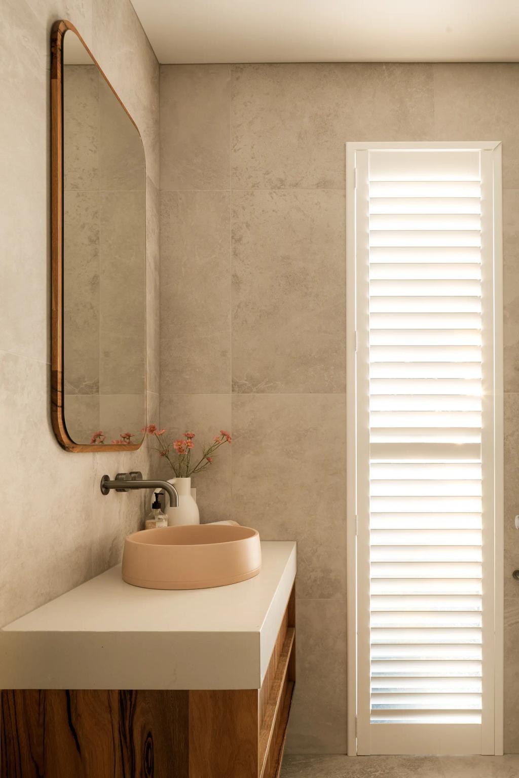 Project Mount Rascal (Modern bathroom with wooden vanity, round beige sink, large mirror, and shuttered window for natural light)