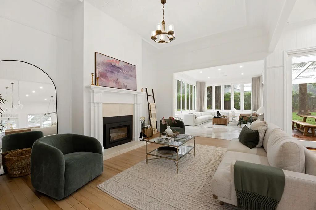 Project Franklin (Bright open-plan living area with fireplace and connected sunroom.)