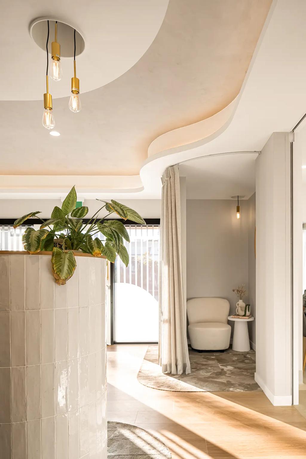 Lavish Constructions - Sole Podiatry (Curved ceiling, pendant lights, and cozy lounge nook.)