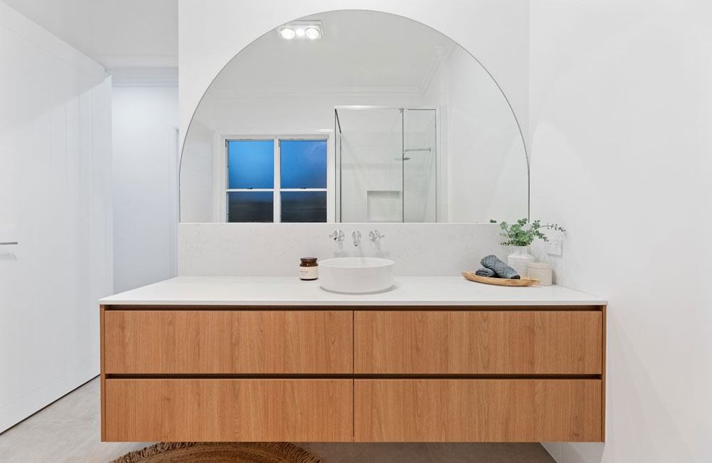 Project Campbell (bathroom sink with wooden cabinet and half circle mirror)