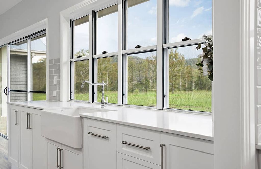 Project Flagstone (white sink and cabinets over a window)