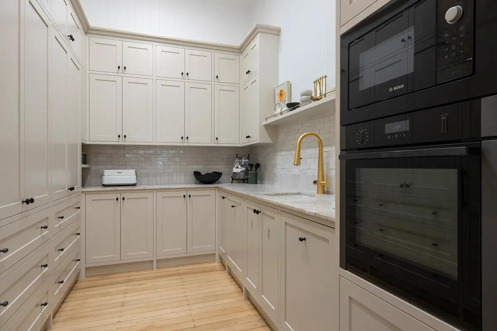 Project Franklin (Butler’s pantry with cream cabinets and gold faucet)