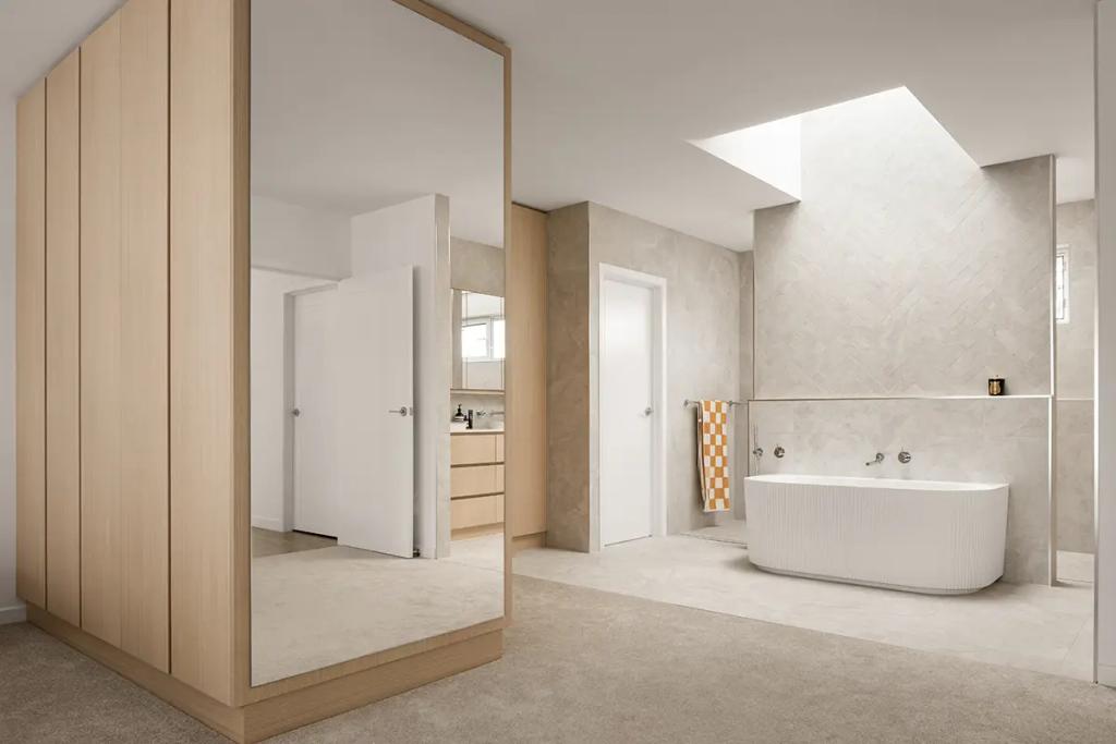 Cheltenham (Modern ensuite with tub under skylight and wood panels)