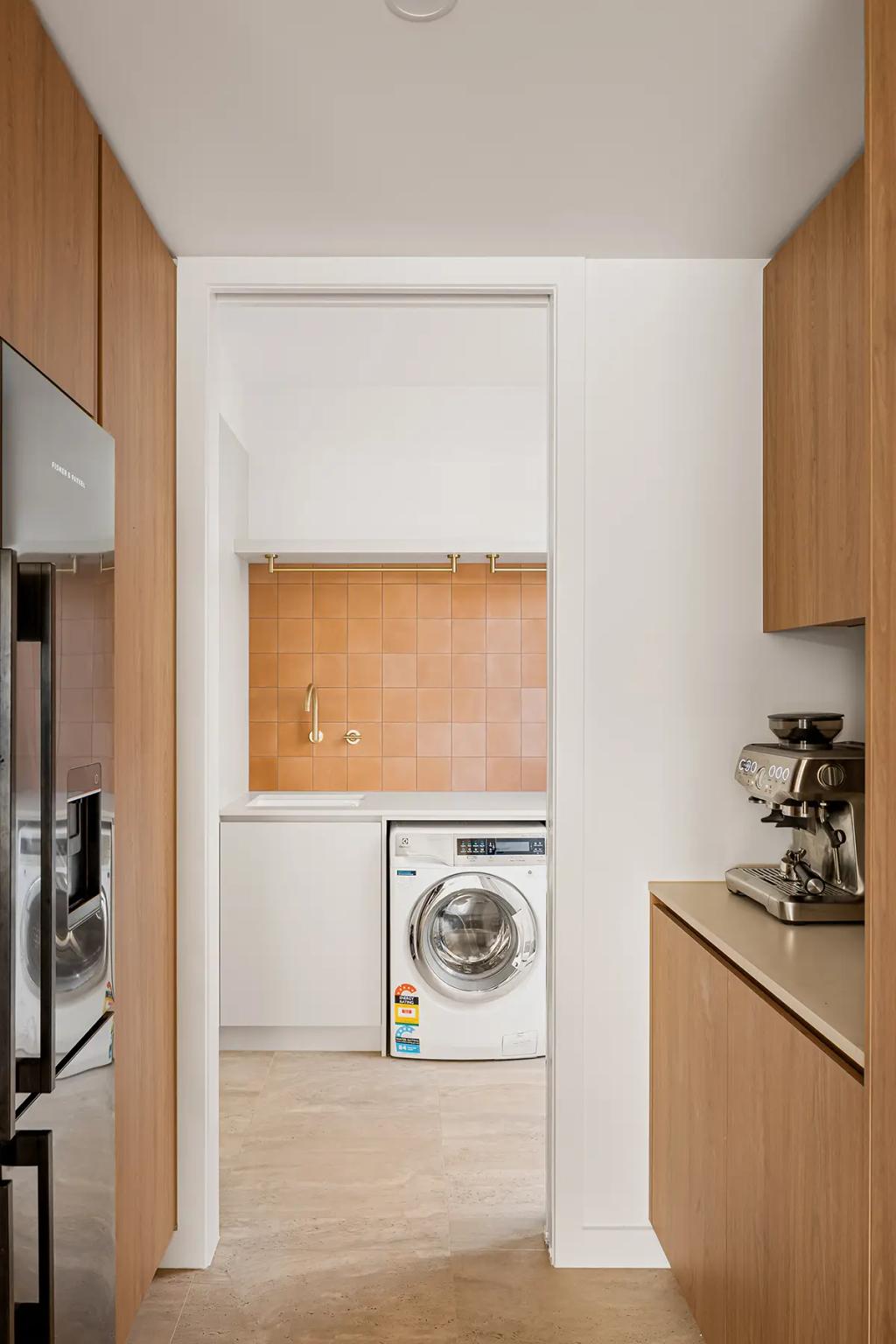 Project Alice (a modern laundry room with white walls and wooden cabinets)