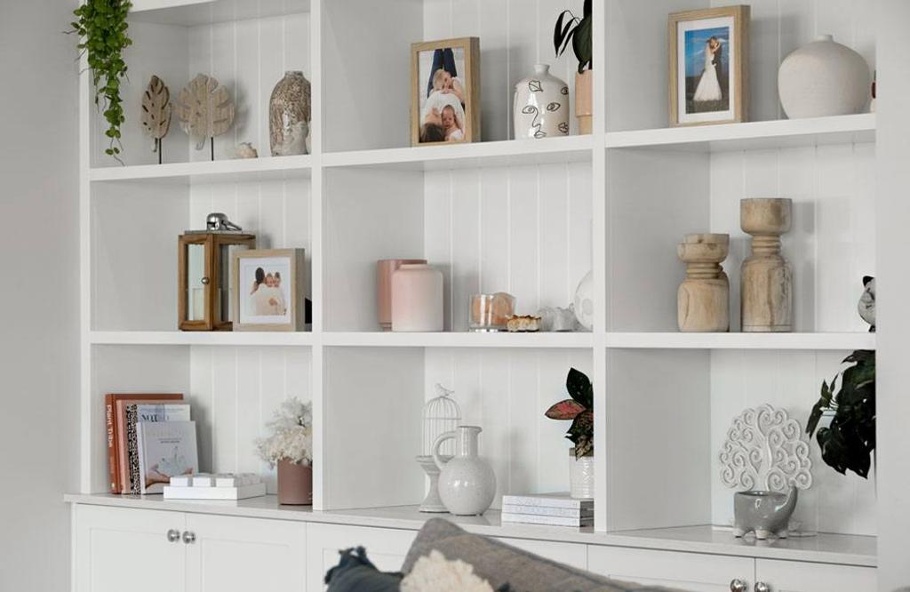 Project Trafalgar (White Bookshelf of Trafalgar house with frames and vases)