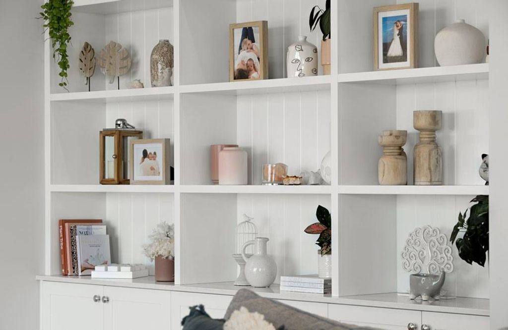 Project Trafalgar (White Bookshelf of Trafalgar house with frames and vases)