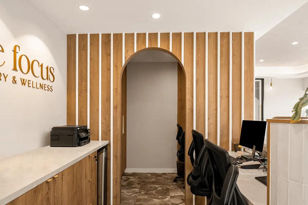Lavish Constructions - Sole Podiatry (Curved ceiling, pendant lights, and cozy lounge nook.)