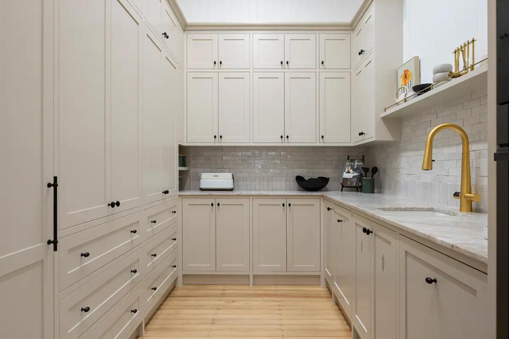 Project Franklin (Cream-toned pantry with shaker cabinets and gold tap.)