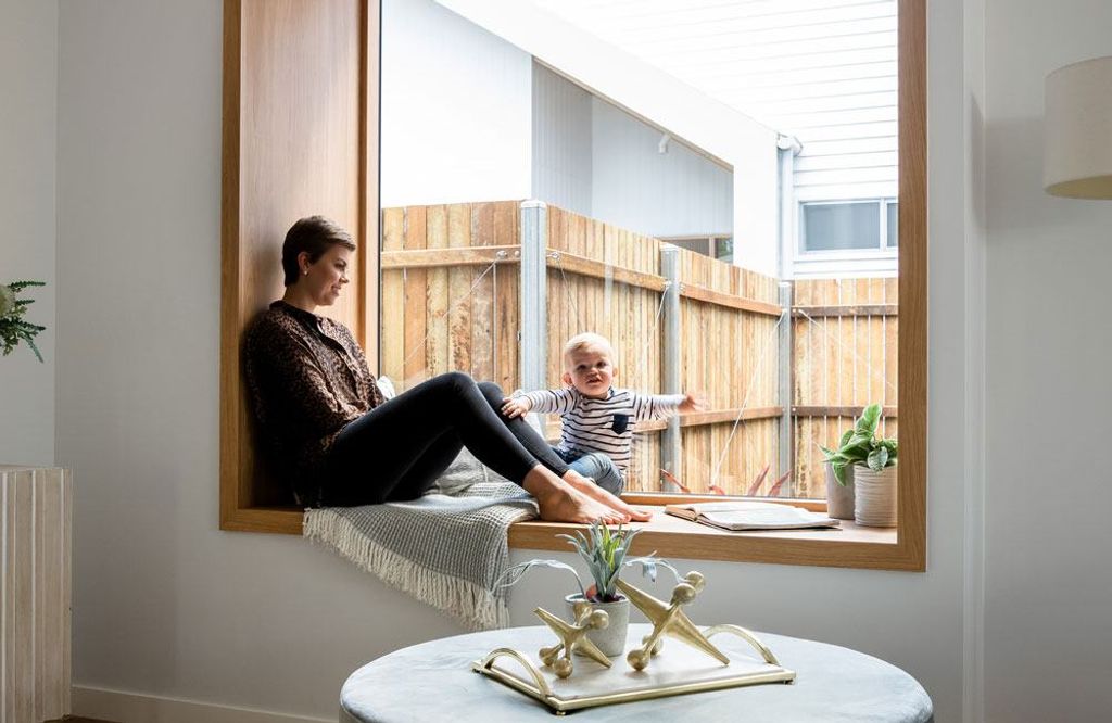 Project Drummond (Girl and a kid sitting beside the glass window)