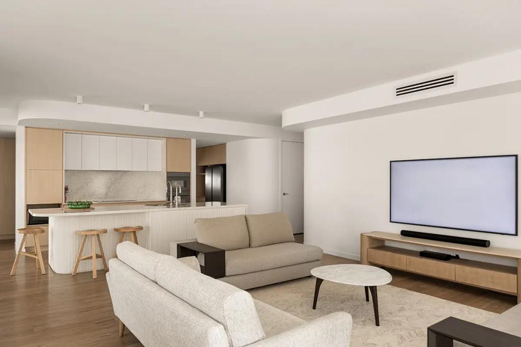 Cheltenham (Open-plan lounge with TV, sofas, and kitchen view)