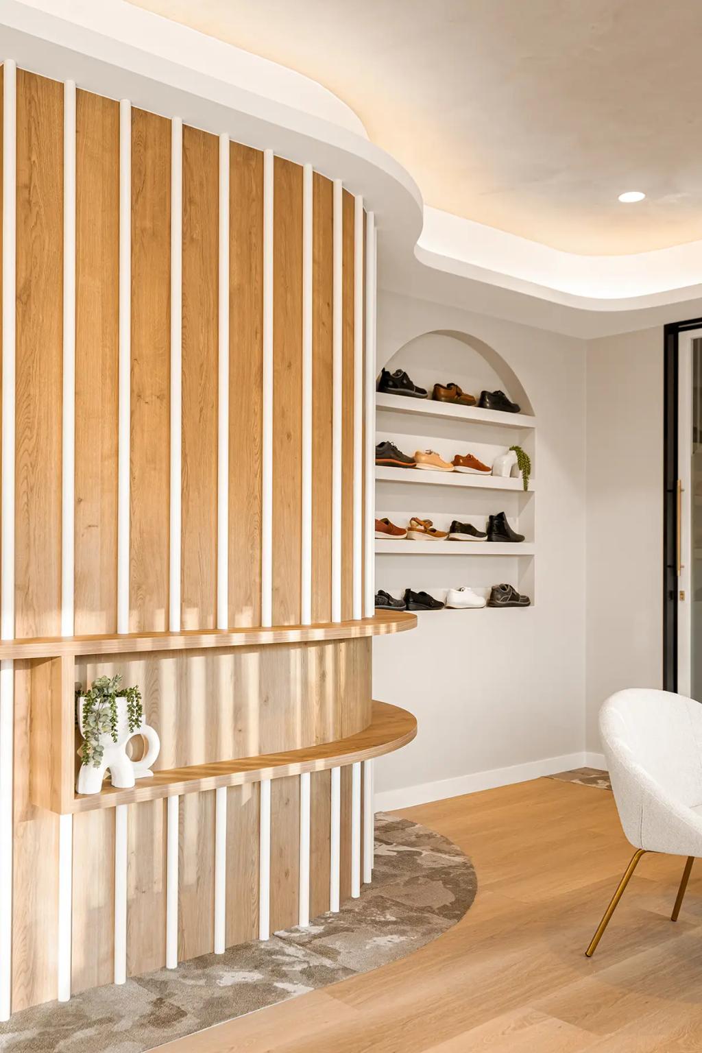 Lavish Constructions - Sole Podiatry (Curved wood reception and arched shoe display wall.)