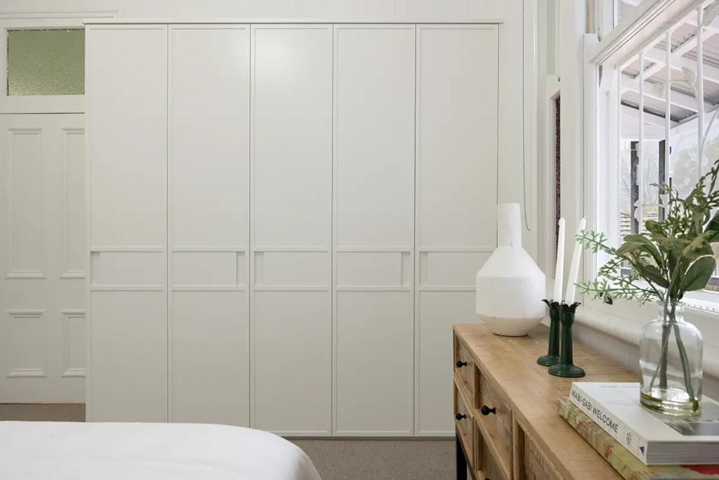 Project Franklin (Minimalist bedroom with white wardrobe and natural light)