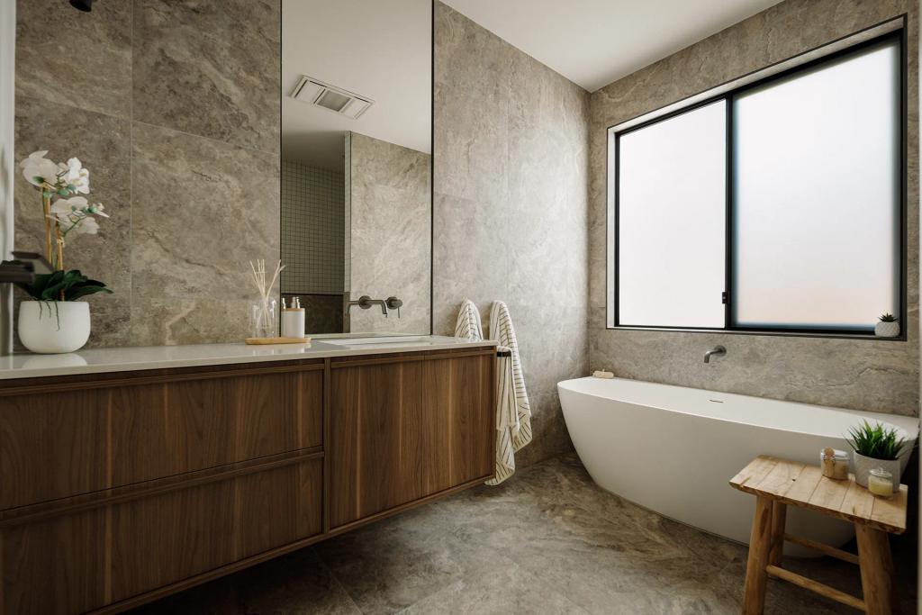 Lavish Morada (Modern bathroom with freestanding tub, wood vanity, stone tile, and frosted glass window.)