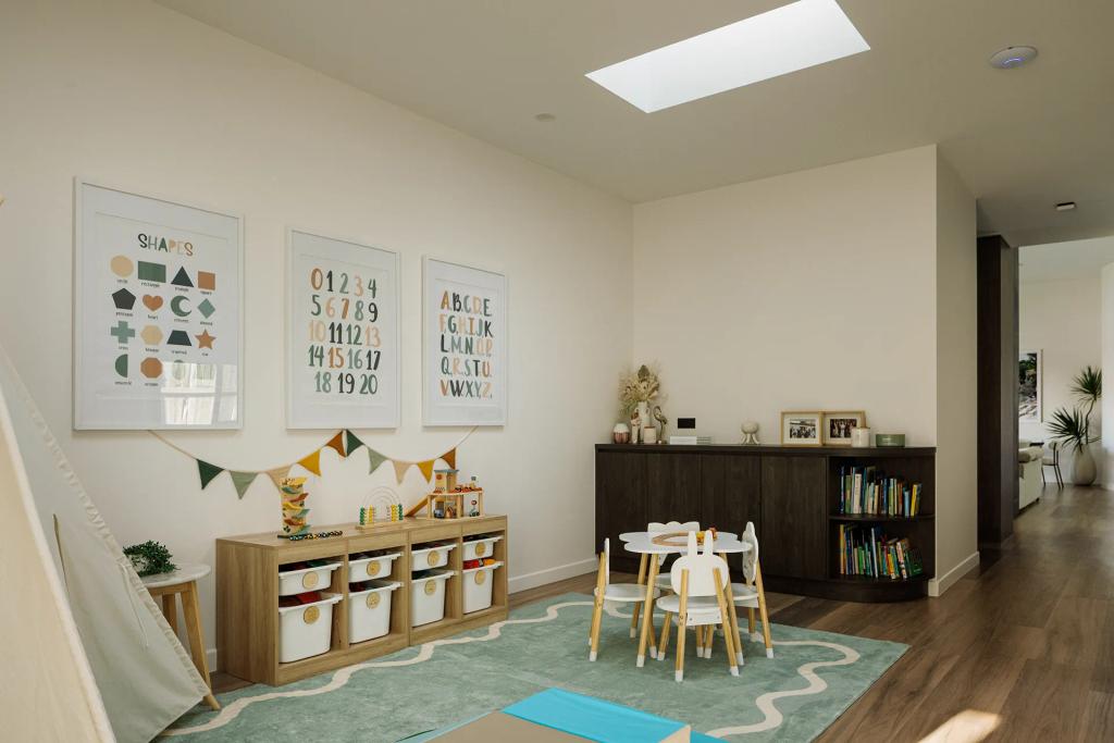 Lavish Morada (Bright playroom with kids’ table, toy storage, educational posters, and wood flooring.)