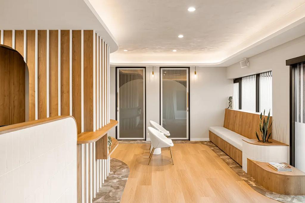 Lavish Constructions - Sole Podiatry (Bright waiting area with wood bench and modern chairs.)