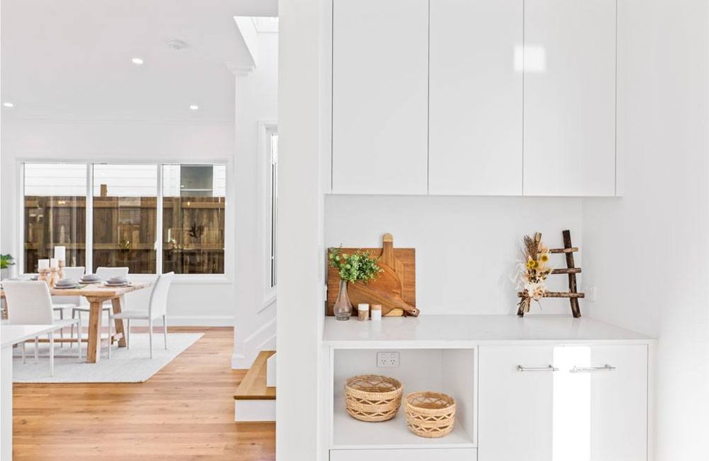 Project Campbell (cabinet with white theme design and half view of dining room)